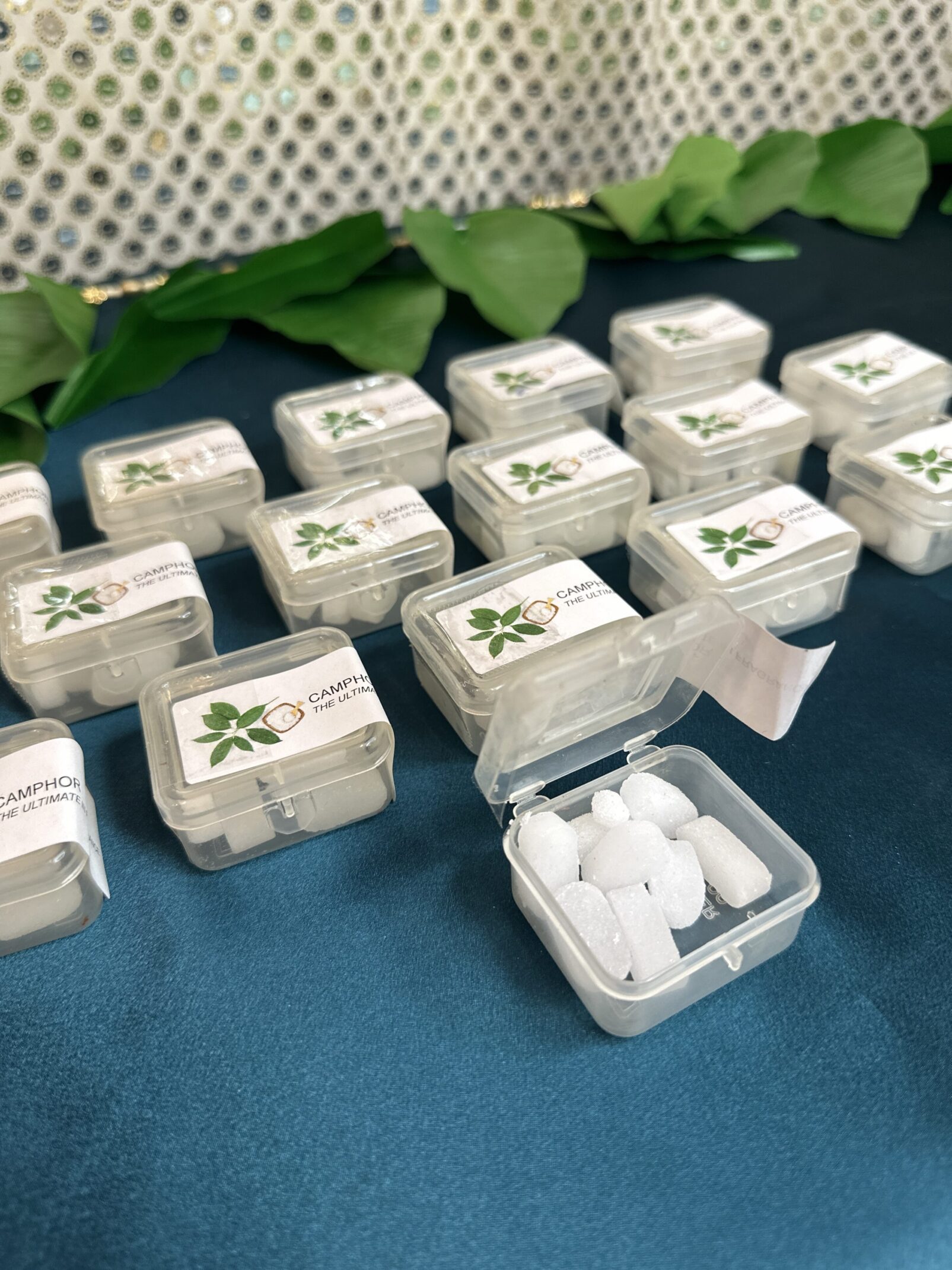 A table with many small containers of pills.