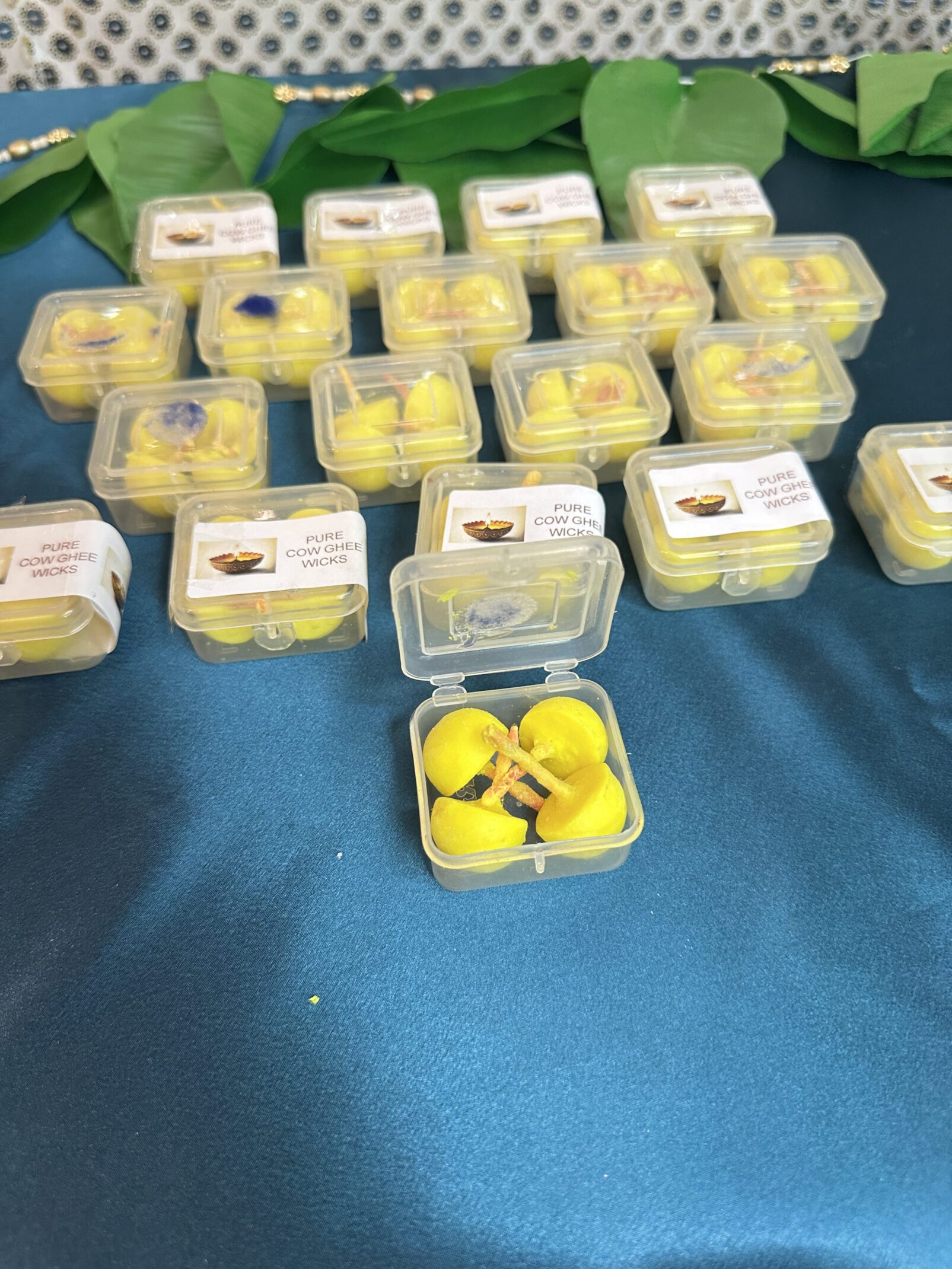 A table with many yellow containers of food