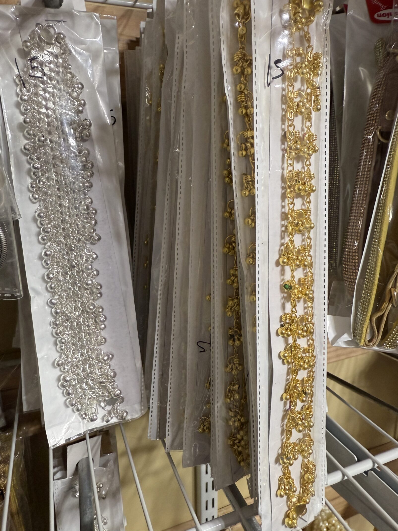 A bunch of different types of fabric hanging up.