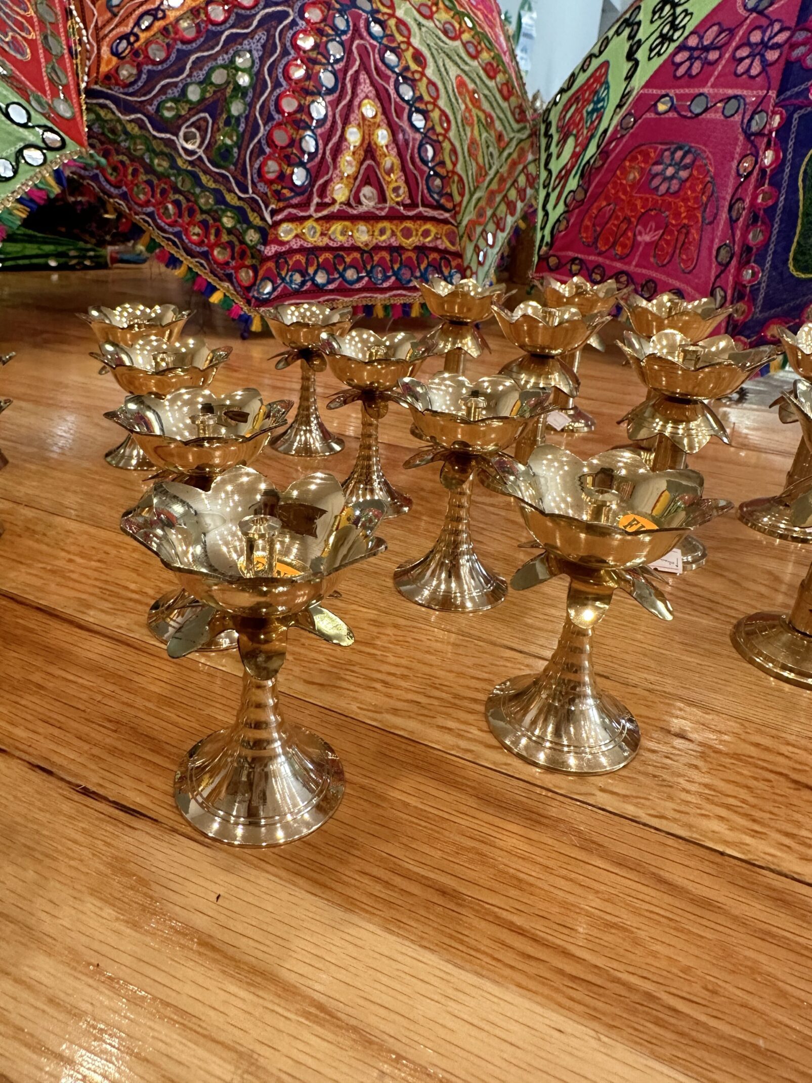 A table with many small gold cups on it