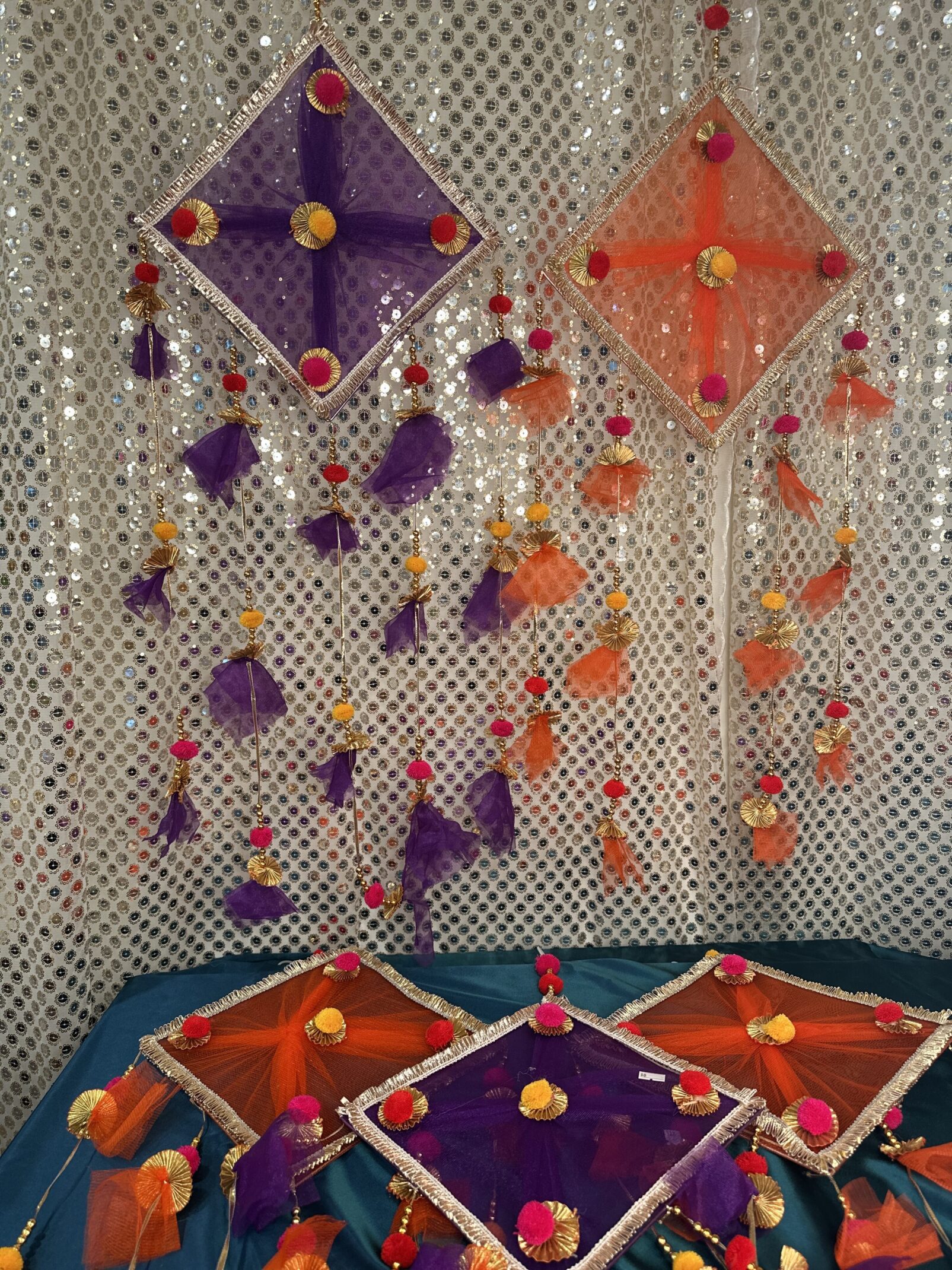 A wall with some kites hanging from it
