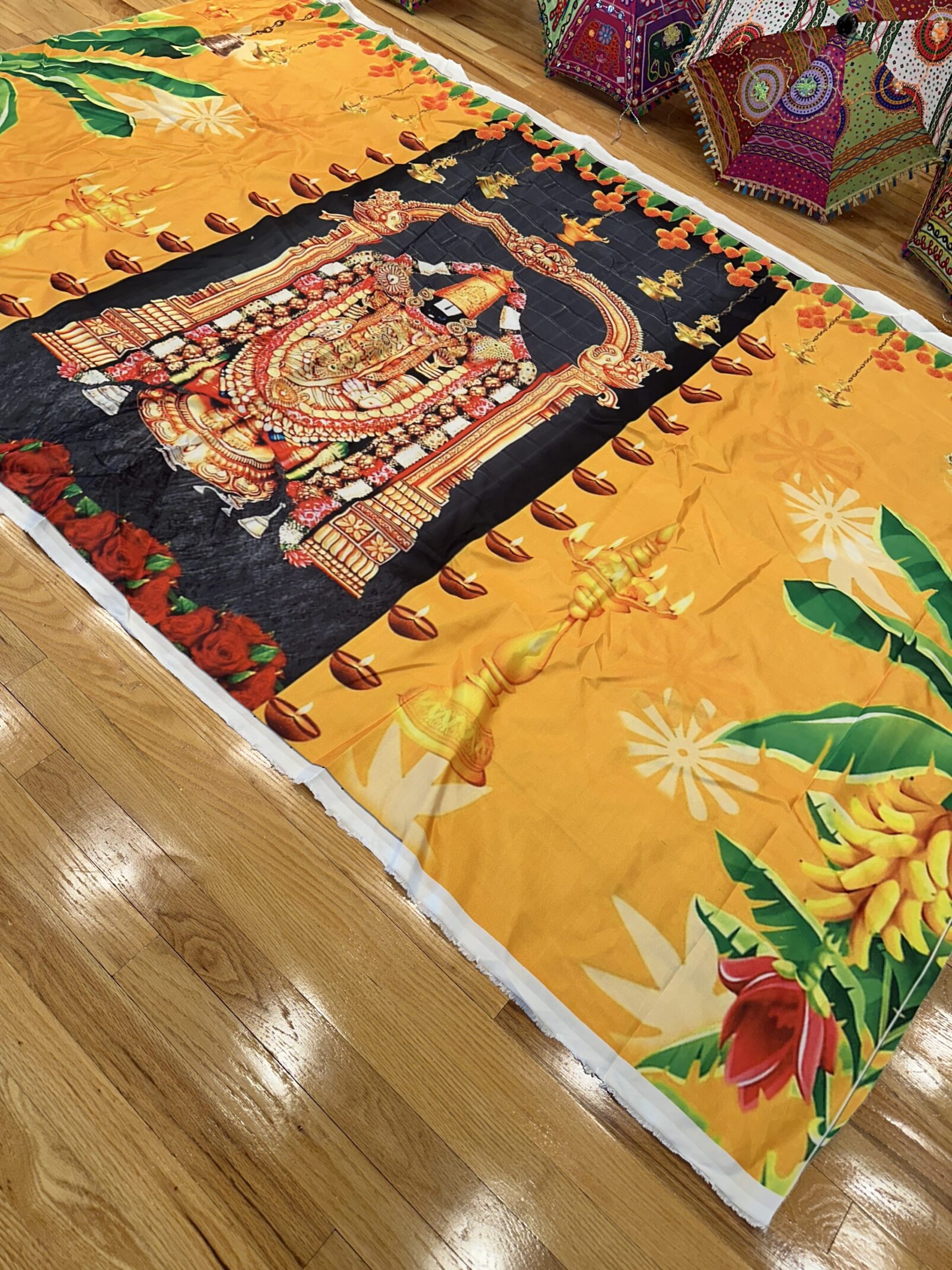 A large yellow blanket with an image of a woman on it.