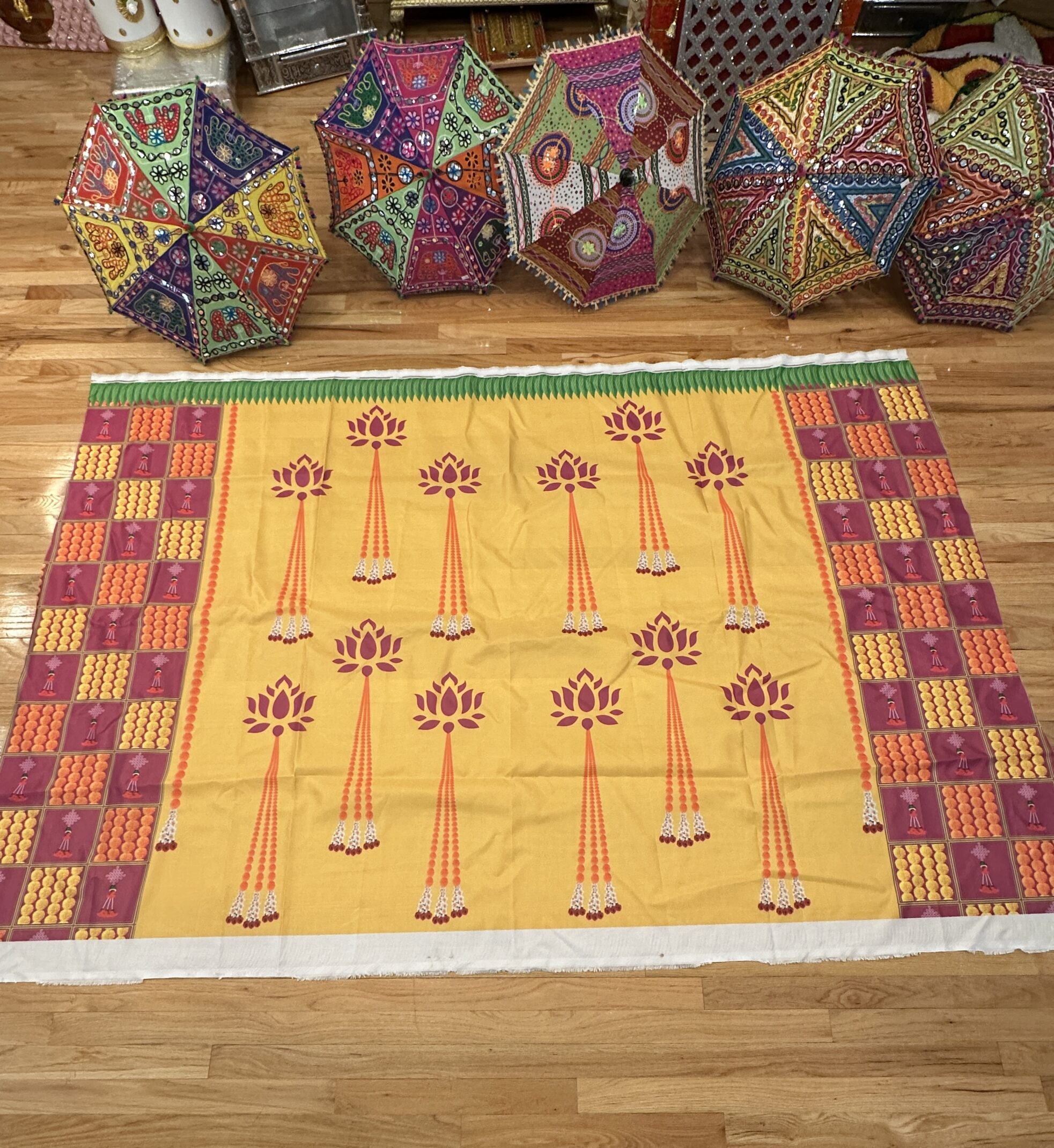 A rug with trees on it and other colorful balls