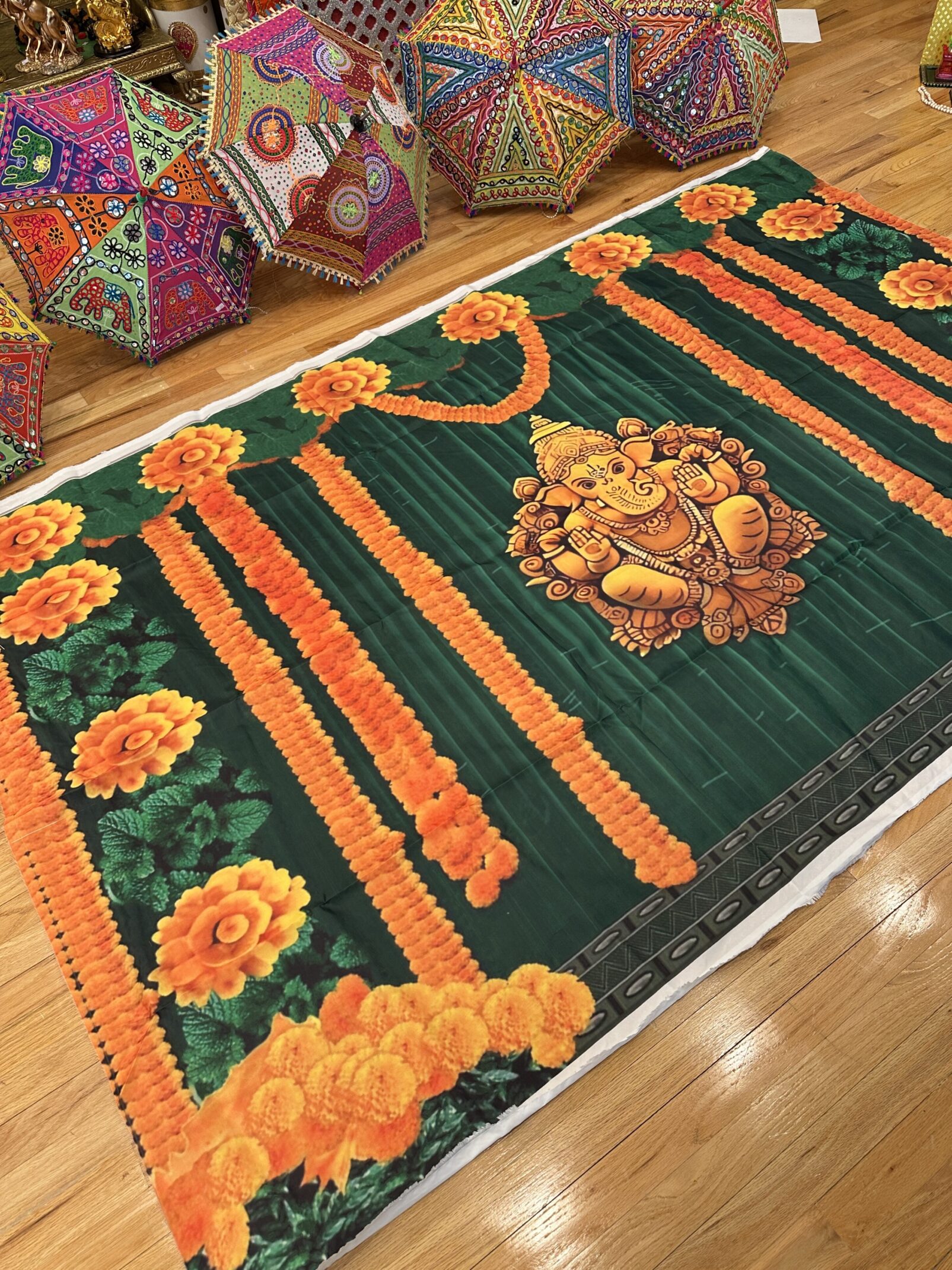 A rug with an image of ganesh on it.